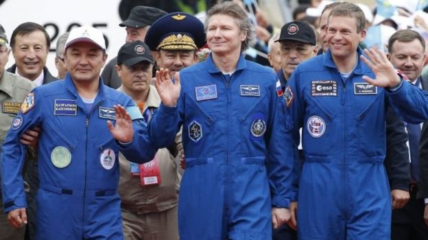 Expedition 44 crew member Gennady Padalka (C) of Roscosmos, visiting crew members Andreas Mogensen (R) of the European Space Agency (ESA) and Aidyn Aimbetov (L) of the Kazakh Space Agency, are welcomed on arrival to Astana, Kazakhstan - 12 September 2015