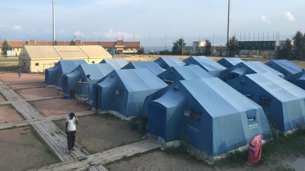 A temporary refugee centre in a sports ground in Messina