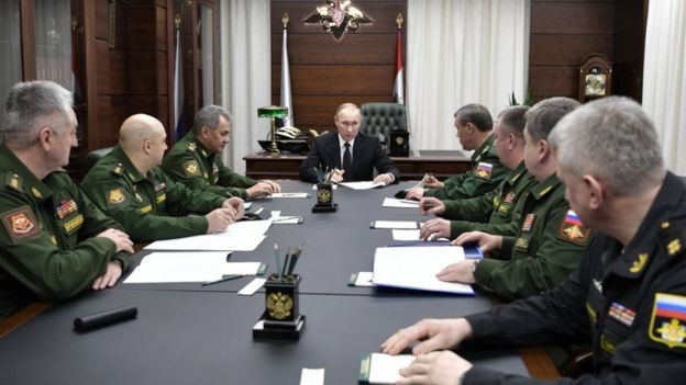 Putin meeting with military guys