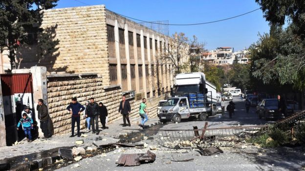 Damage outside a school in government-held western Aleppo after it was struck by rebel shellfire (20 November 2016)