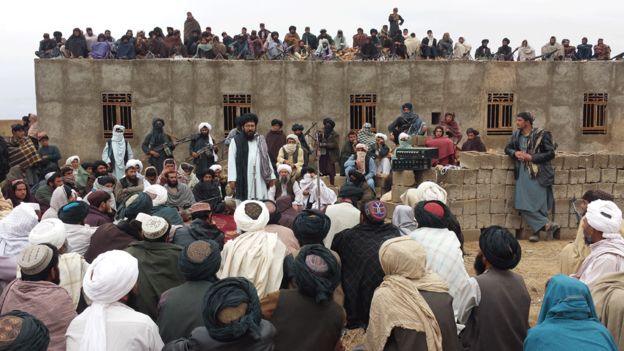 Mullah Rasool addresses Taliban fighters at the meeting in Farah