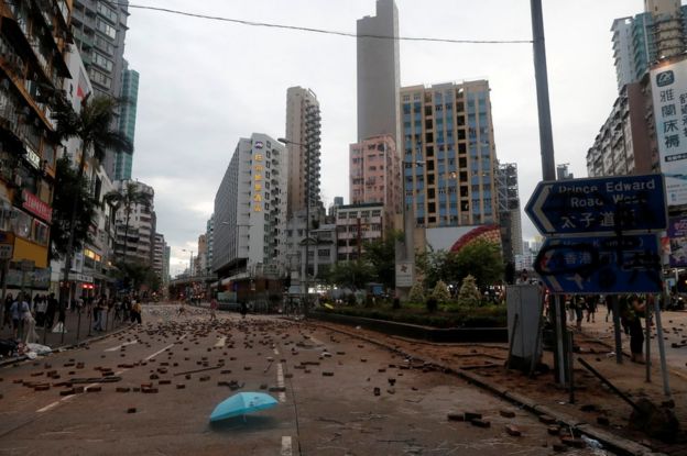 Bricks and debris are seen in a street in Hong Kong, China October 6, 2