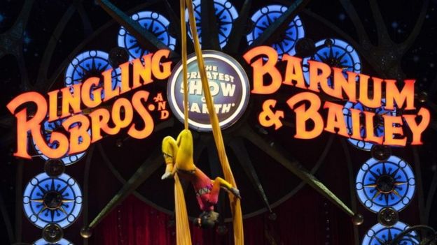 A circus performer hanging upside down during a Ringling Bros and Barnum and Bailey Circus performance in Washington DC on 19 March 2015