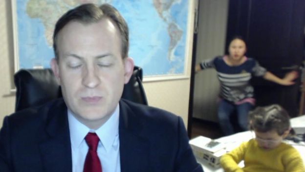 Screen grab from Prof Kelly's interview, with his wife and children in the background