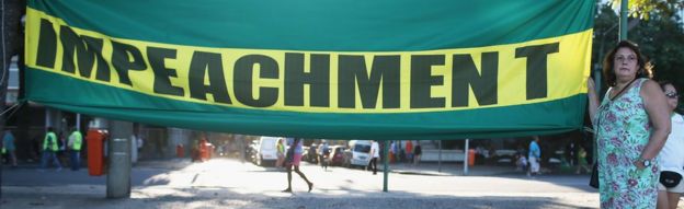 Demonstrator in Brazil shows sign in favour of impeachment