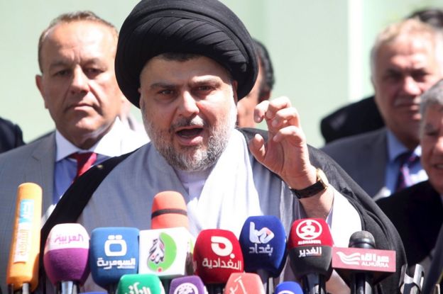Iraqi Shia cleric Moqtada al-Sadr speaks during news conference in Najaf (22 March 2016)