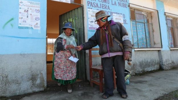 Voters leave at a polling station in Patamanta, Bolivia, on 20 October 2019