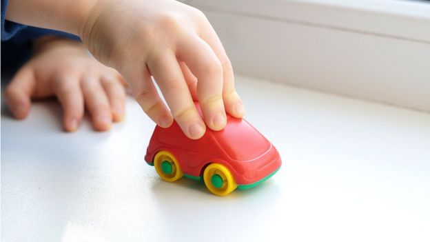 Child playing with toy