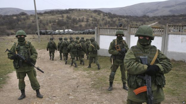 Soldiers in unmarked camouflage blockading Ukrainian Perevalne base in Crimea, March 2014