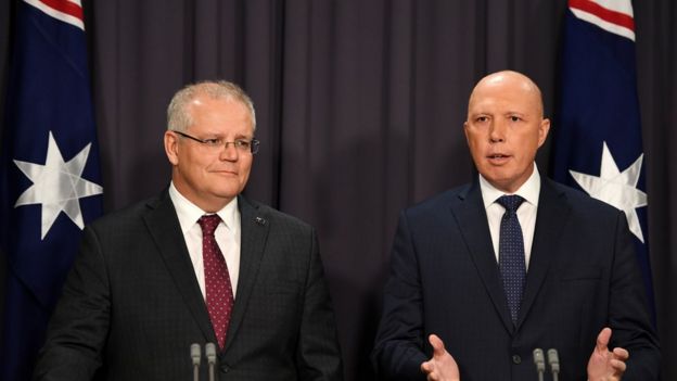 Australia's Prime Minister Scott Morrison (left) and Home Affairs Minister Peter Dutton