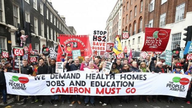 People in London protesting against government cuts