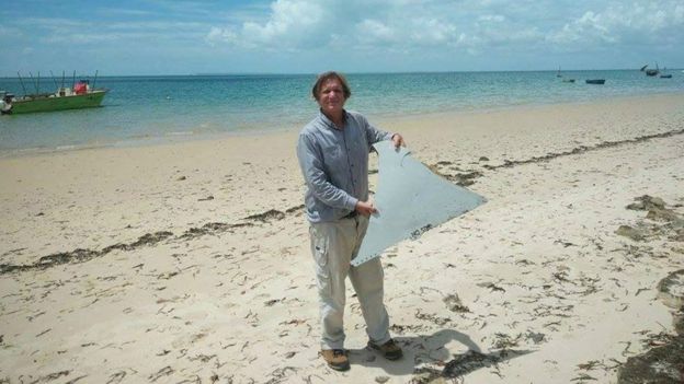 Blaine Gibson with piece of debris found in Mozambique