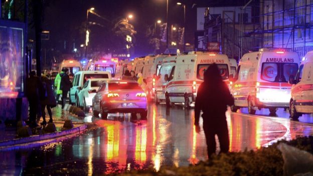 Medics and security officials work at the scene after an attack at a popular nightclub in Istanbul