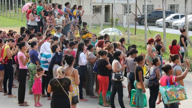 Relatives of inmates ask for information at the main gate of the Anisio Jobim Penitentiary Complex after a riot left at least 60 people killed and several injured, in Manaus