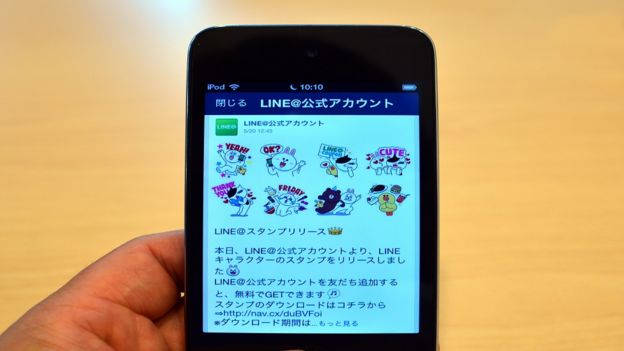 A man uses Japan's smartphone based social networking service 'LINE' in Tokyo on 3 August, 2014