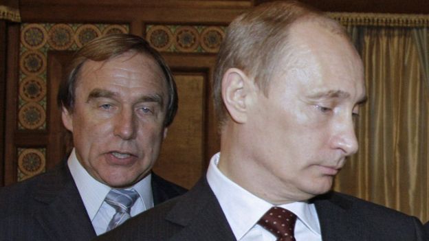 2009 image shows Sergei Roldugin (left) with Vladimir Putin