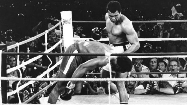 Muhammad Ali watches as defending world champion George Foreman goes down to the canvas in the eighth round of their WBA/WBC championship match in Kinshasa, Zaire - 30 October 1974