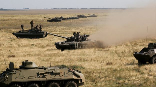 Ukrainian tanks and APCs move towards the de-facto border with Crimea near Kherson, southern Ukraine, Friday, Aug. 12, 2016