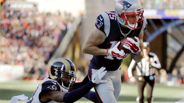 New England Patriots wide receiver Chris Hogan (15) catches a pass for a touchdown against Los Angeles Rams cornerback E.J. Gaines (33) during the first half of an NFL football game, Sunday, Dec. 4, 2016