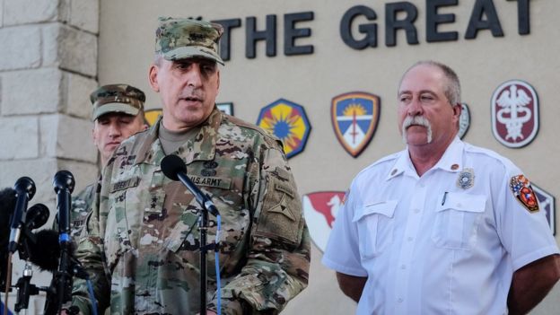 Maj. Gen. John Uberti, Fort Hood deputy commander, center, Col. Todd Fox, left, and Fort Hood fire chief Coleman Smith, right, speak to the media during a news conference in Fort Hood, Texas, on Friday, June 3, 2016.