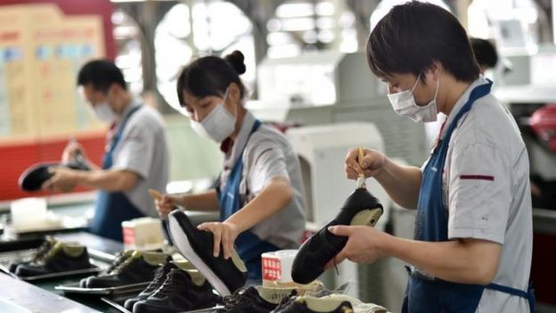 Workers in a shoe factory in China