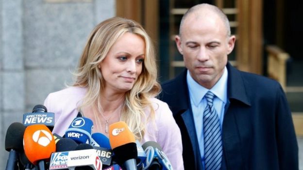 Adult film actress Stephanie Clifford, also known as Stormy Daniels, speaks to media along with lawyer Michael Avenatti (R) outside federal court in the Manhattan borough of New York City, New York, on 16 April 2018