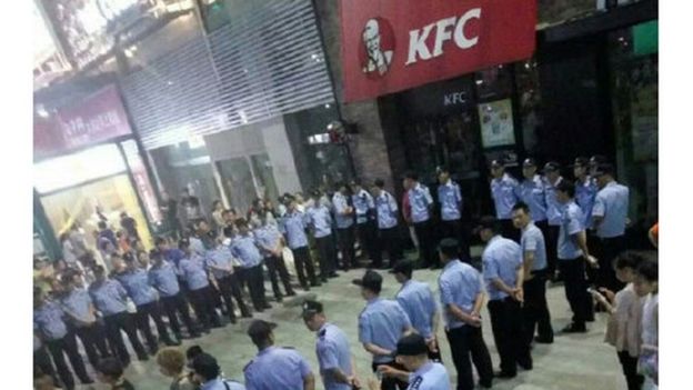 Photos of protesters at anti-KFC protests from Weibo