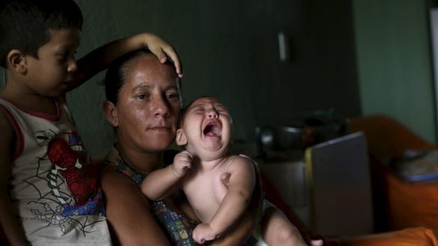 Josemary da Silva, 34, holds 5-month-old Gilberto as her older son Jorge Gabriel, 4 (L), stands by her side at her house in Algodao de Jandaira, Brazil February 17, 2016.