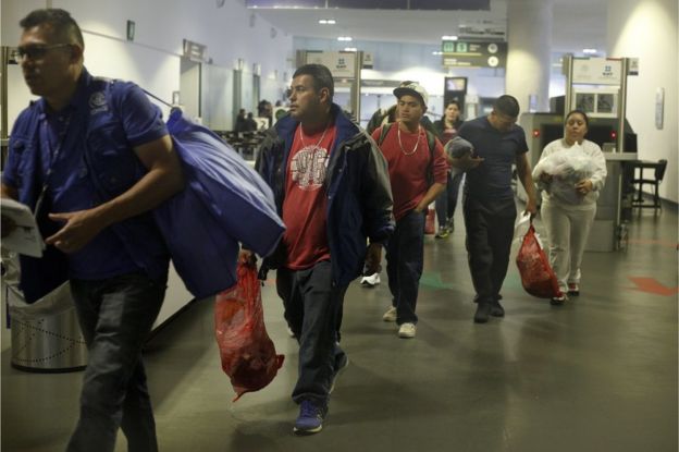Mexican citizens arrive at the airport in Mexico City after being deported from the US, 23 February