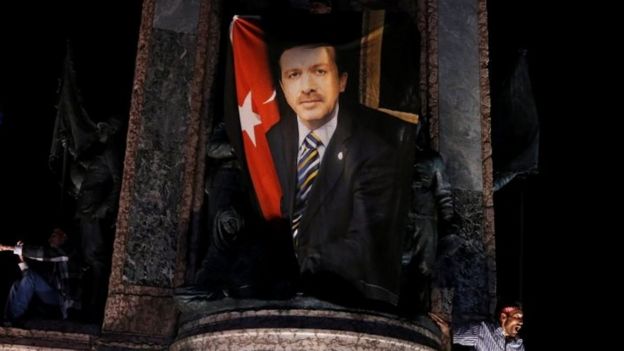 A banner photo of President Erdogan, on the Republic monument during a pro-government demonstration on Taksim Square in Istanbul (21 July 2016)