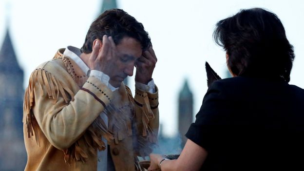 Canada's Prime Minister Justin Trudeau takes part in a smudging ceremony during the National Aboriginal Day Sunrise Ceremony in Gatineau, Quebec, Canada, June 21, 2016
