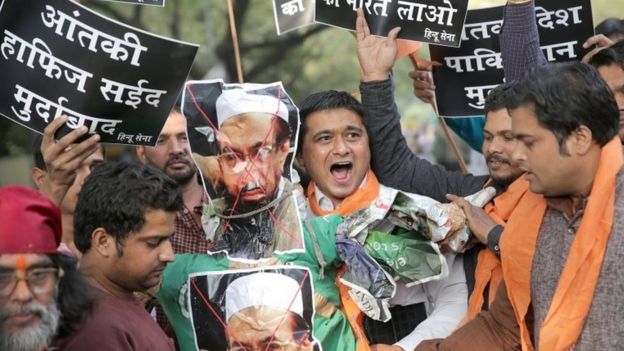 Indian activists from the right-wing organisation, Hindu Sena, burn the posters and effigy of the Jamat-ud-Dawah chief and 26/11 attacks mastermind Hafiz Saeed in New Delhi