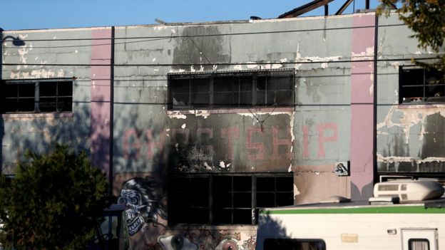 A charred wall is seen outside a warehouse after a fire broke out during an electronic dance party late Friday evening, resulting in at least nine deaths and many unaccounted for in the Fruitvale district of Oakland, California, U.S. December 3, 2016.