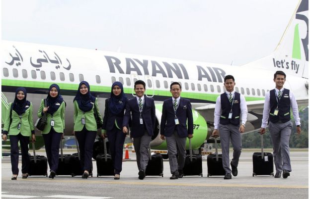 A picture made available on 21 December 2015 shows Rayani Air the Malaysia's first Islamic-compliant airline cabin crew posing for a photograph in front of a Boeing 737-400 at Kuala Lumpur International Airport 2, in Sepang, Malaysia, 20 December 2015
