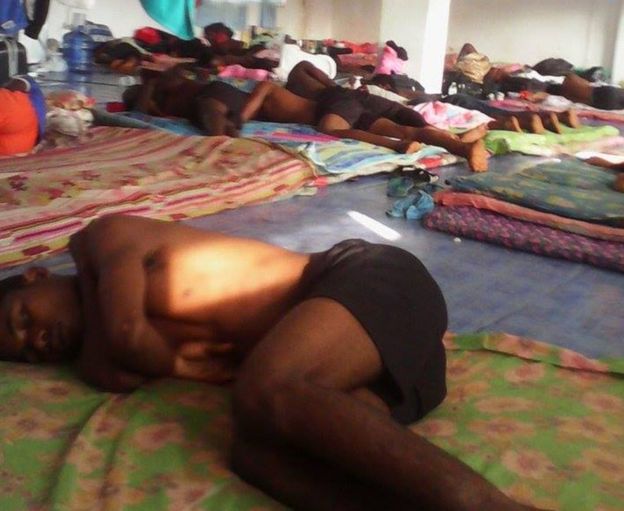 boys sleep on the floor in crowded accommodation