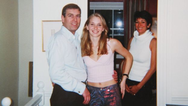 Prince Andrew with Virginia Giuffre, and Ghislaine Maxwell standing behind, in early 2001 (said to have been taken at Maxwell’s London home)