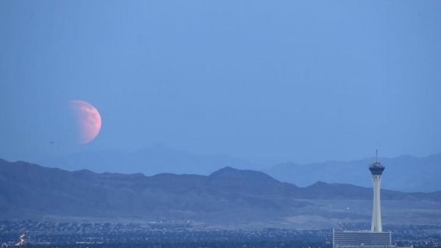 A partially eclipsed supermoon over the US city of Las Vegas