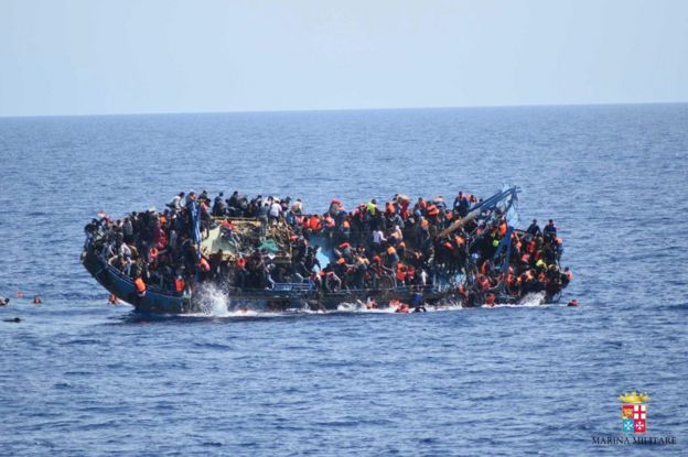Migrants cling to a capsizing boat in the Mediterranean, 25 May