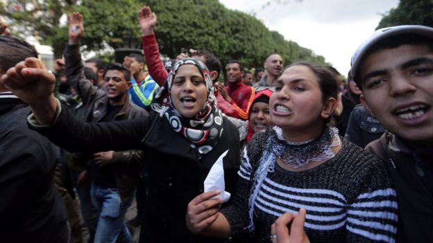 Unemployed graduates shout slogans during a demonstration urging the government to provide them with job opportunities, in Tunis. Photo: January 2016