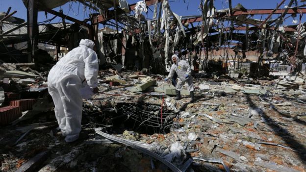 Forensic experts investigate the scene at a community hall, two days after alleged Saudi-led airstrikes hit it, in Sanaa, Yemen, 10 October 2016