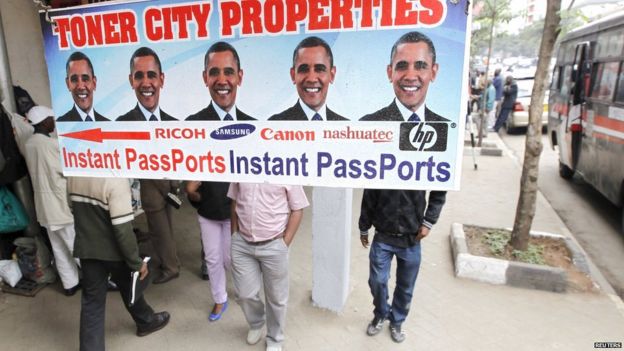 Residents walk past a commercial poster with the portrait photo of the U.S. President Barack Obama ahead of his scheduled State visit in Kenya's capital Nairobi July 23, 2015