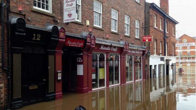 Flooded riverside properties in Kings Street, York