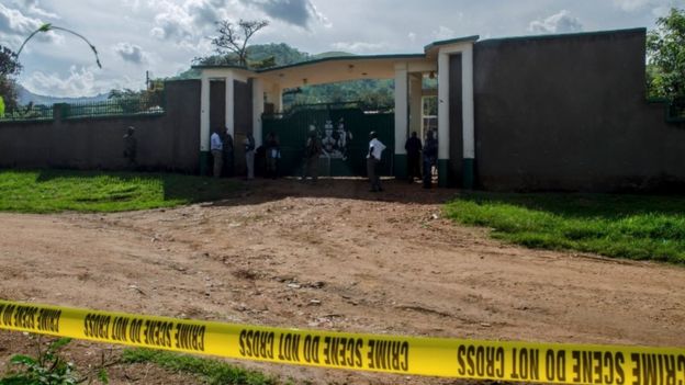 Security officers stand at the entrance of the palace of Rwenzururu kingdom.