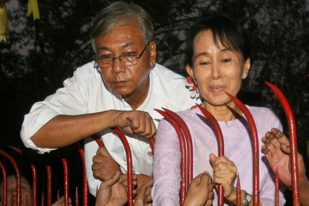 In this file picture taken on 13 November 2010, Htin Kyaw (L), a senior National League for Democracy (NLD) official stands next to Aung San Suu Kyi (R) at her residence on the day of her release from house arrest in Yangon where she was detained for nearly two decades