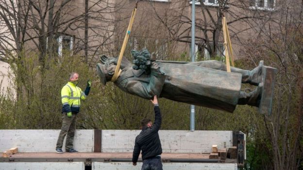 Workers remove a statue of Ivan Konev in Prague