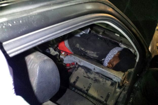 African migrant hiding in car dashboard, 2 Jan 17 (Spanish Civil Guard photo)