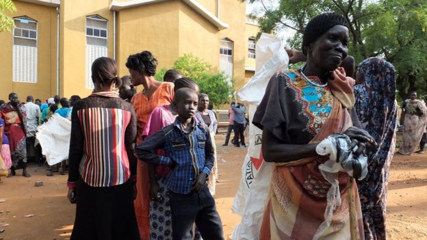 South Sudan women displaced in recent fighting queue to receive relief supplies as they camp at the Kator Catholic cathedral compound in Juba, South Sudan, July 12, 2016