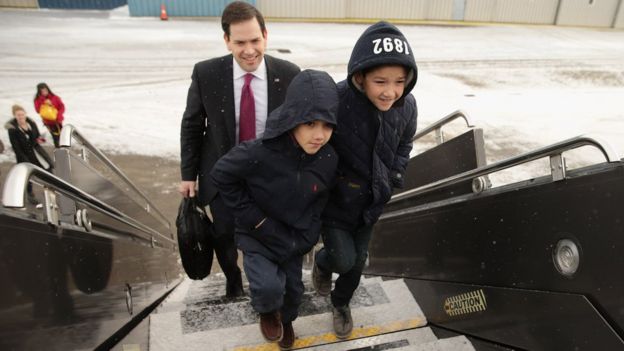 Marco Rubio boards a plane to South Carolina with sons