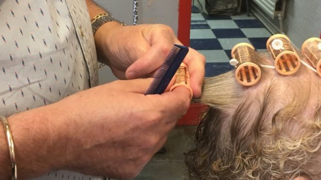 Putting hair in rollers