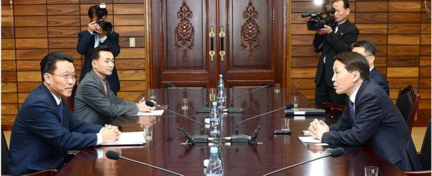 South Korean chief delegate Kim Ki-Woong (right) talks with his North Korean counterpart Hwang Chol (left) during their meeting at the truce village of Panmunjom in November